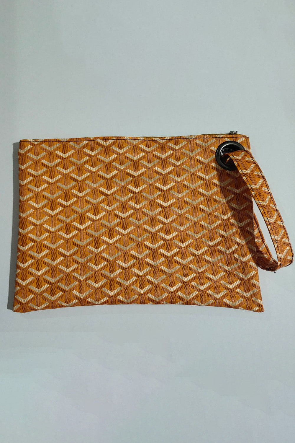 Tangerine plaid print wristlet clutch bag with grommet detail