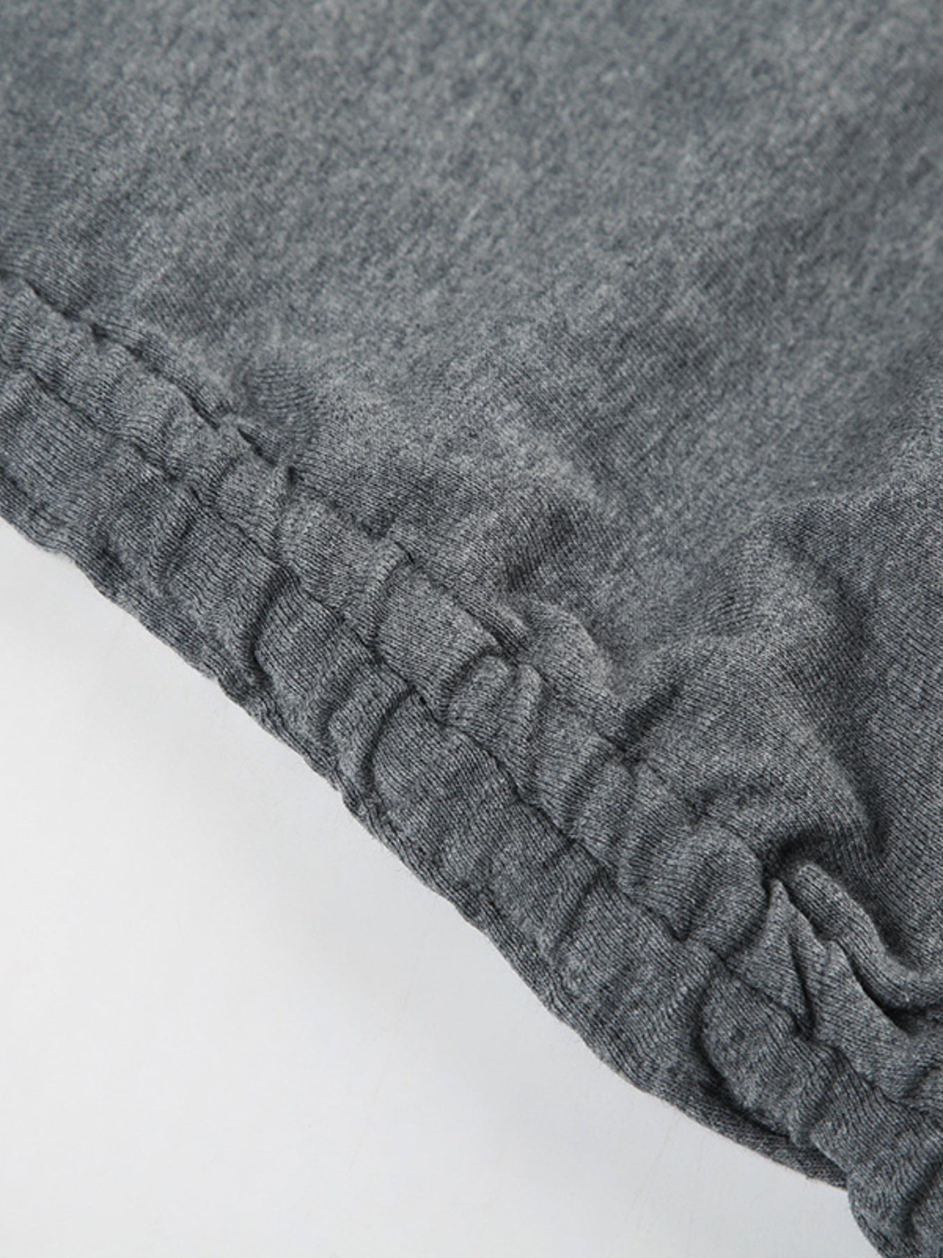 Ruched bodycon mini dress in grey jersey with adjustable drawstring detail.
