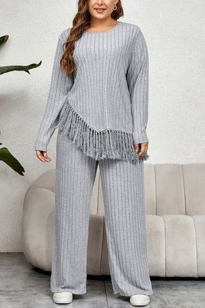 Ribbed lounge set in grey with fringe hem detail, long sleeves, and wide-leg pants.