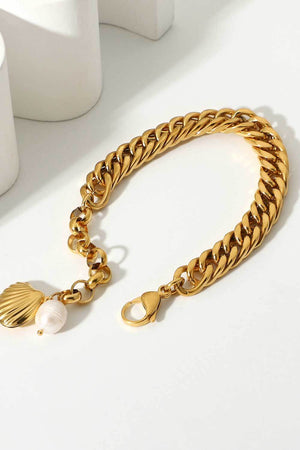 Gold chain bracelet with seashell and pearl charms
