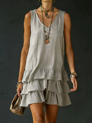 Grey tiered ruffled hem V-neck sleeveless mini dress with layered ruffles.