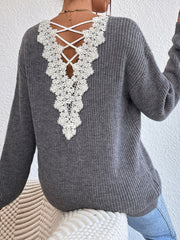 Gray ribbed knit sweater with white lace back detail and criss-cross straps.