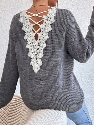 Gray ribbed knit sweater with white lace back detail and criss-cross straps.