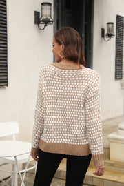 Textured bouclé knit sweater in camel and white geometric pattern with contrast trim.