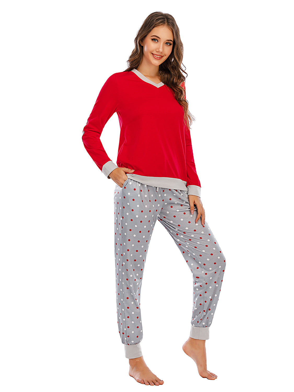 Red long sleeve lounge top with grey trim and grey polka dot pants.