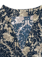 Maternity blouse with notch neckline and ornate floral print in navy, tan, and blue.