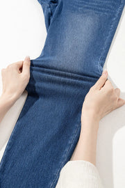 Denim-effect leggings in medium blue, showing stretch fabric and high-rise cut.