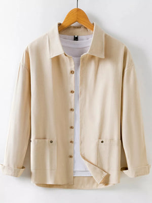 Khaki long sleeve button-up shirt with two chest pockets and a white t-shirt underneath.