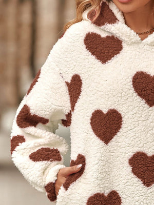 Fuzzy sherpa hoodie with all-over brown heart print.