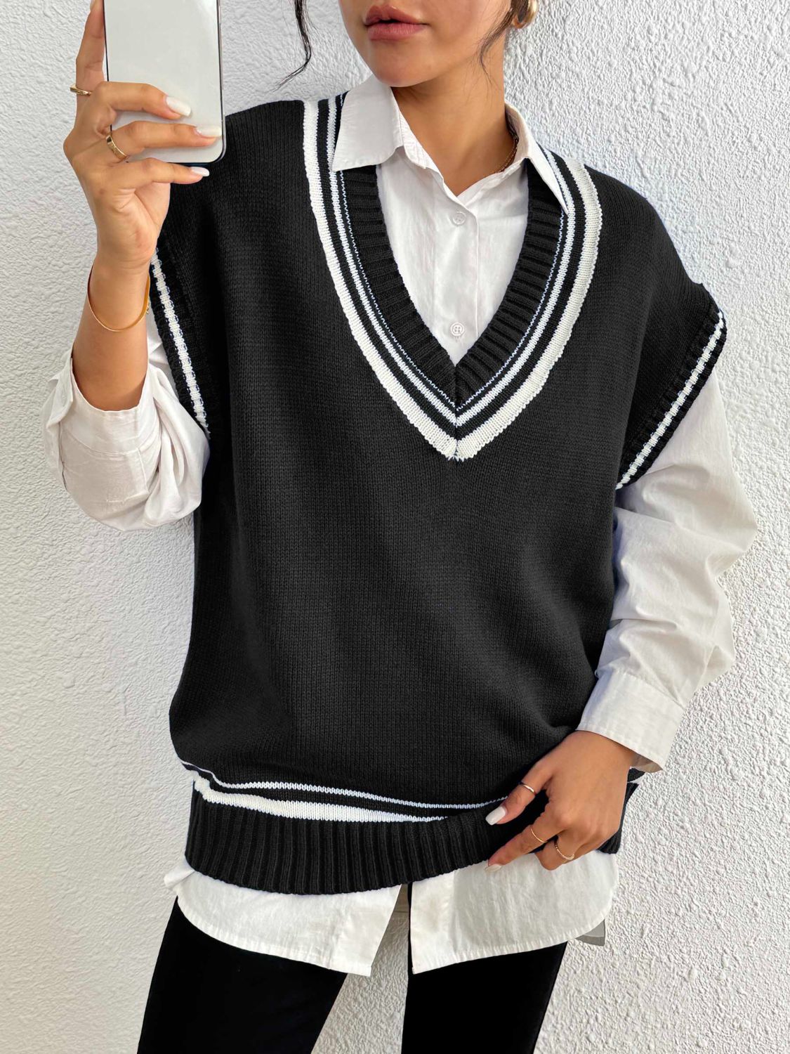 Black acrylic knit vest with contrast trim V-neck and hem