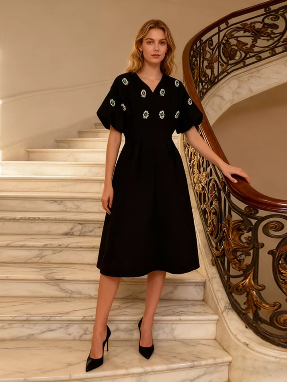 Black midi dress with puff sleeves and rhinestone embellishments.