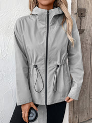 Gray hooded utility jacket with cinched waistline and black zipper