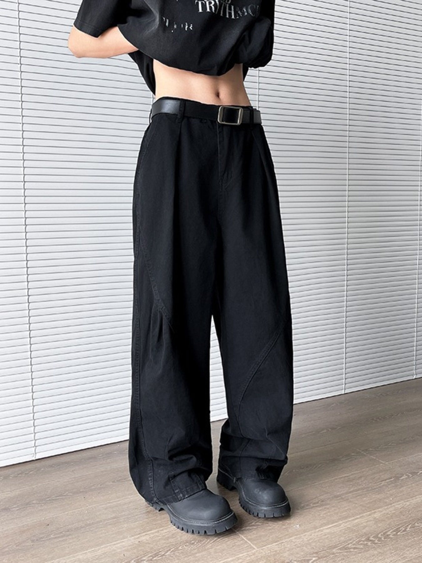 Men's black wide leg sweatpants with belt loops and pockets.