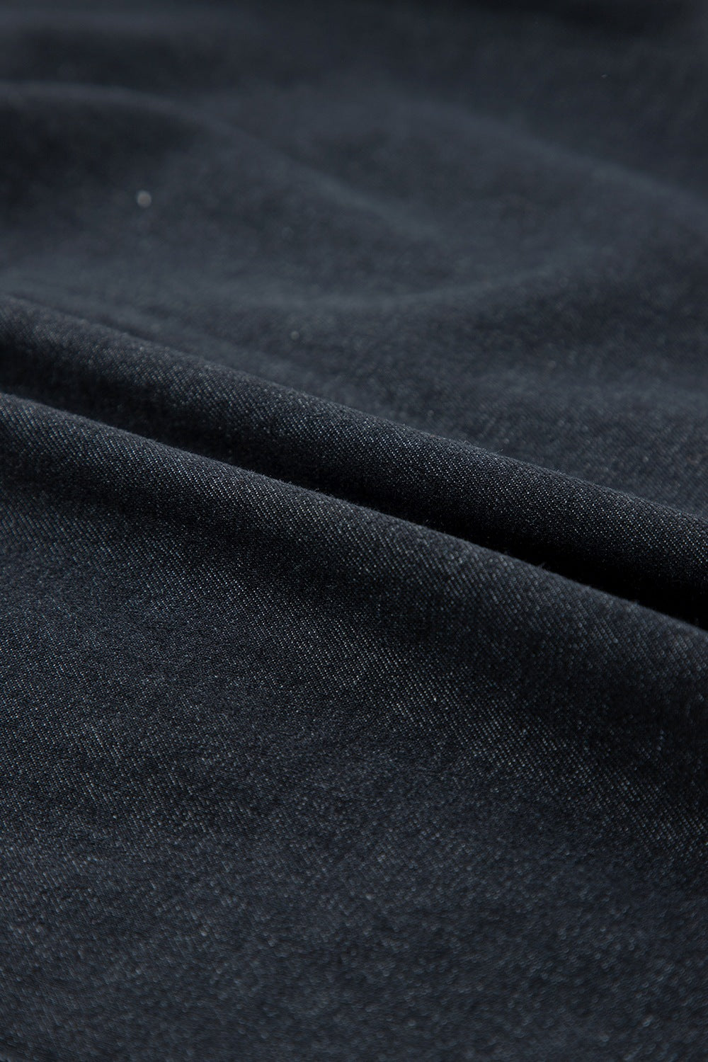 Black denim button-up shirt with frayed ruffle trim detail