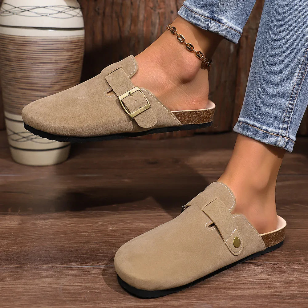 Suede buckle mules in mocha with cork sole detail.