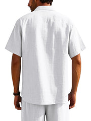 White short sleeve button-down shirt with pockets, collared neckline and breathable fabric.