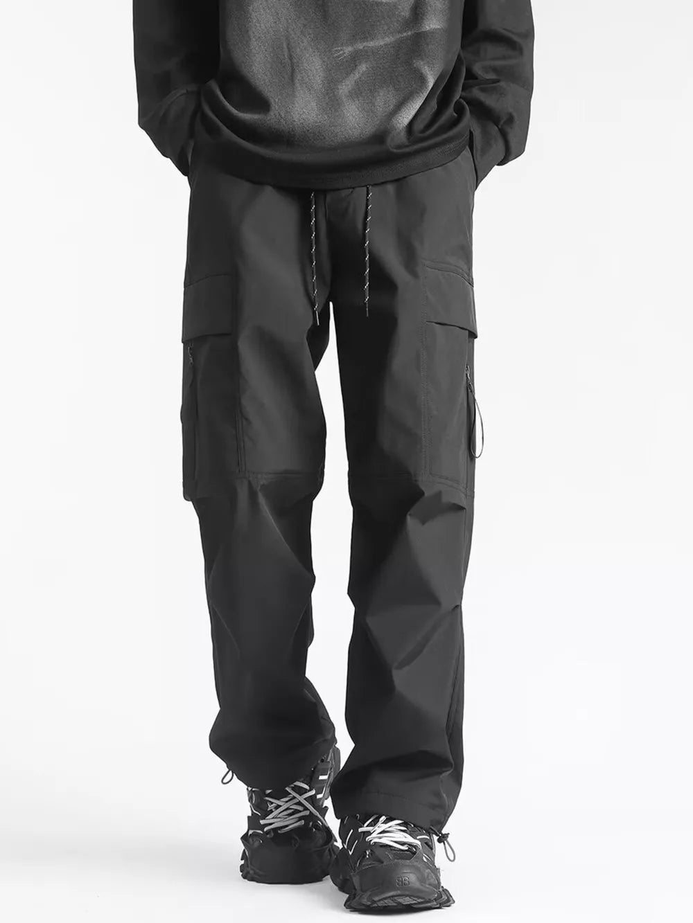 Men's black relaxed fit cargo sweatpants with ankle drawstring and adjustable waist.