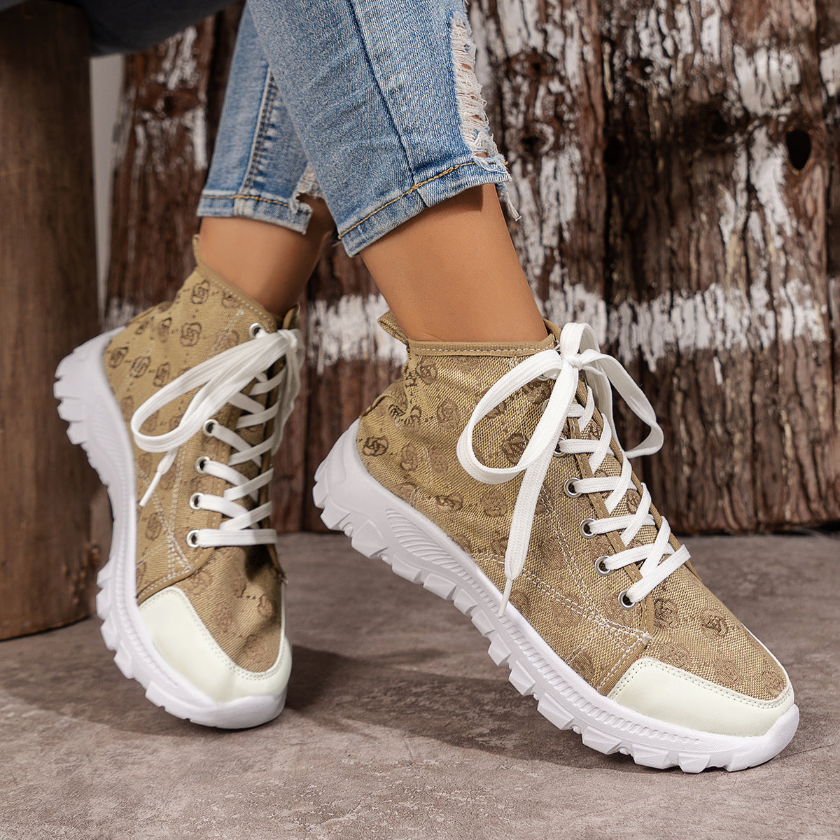 Khaki canvas lace-up high-top sneakers with white soles and toe caps.
