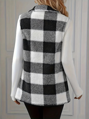 Textured black and white buffalo check vest jacket with collar and buttoned front, worn over a white long-sleeve shirt.