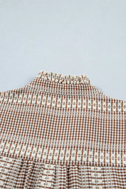 Brown gingham maternity shirt with embroidered yoke and ruffled neckline.