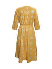 Yellow geometric print empire waist midi dress with 3/4 sleeves.