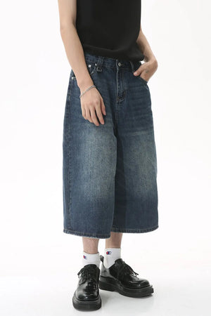Wide-leg denim culottes in light blue wash with a relaxed fit.