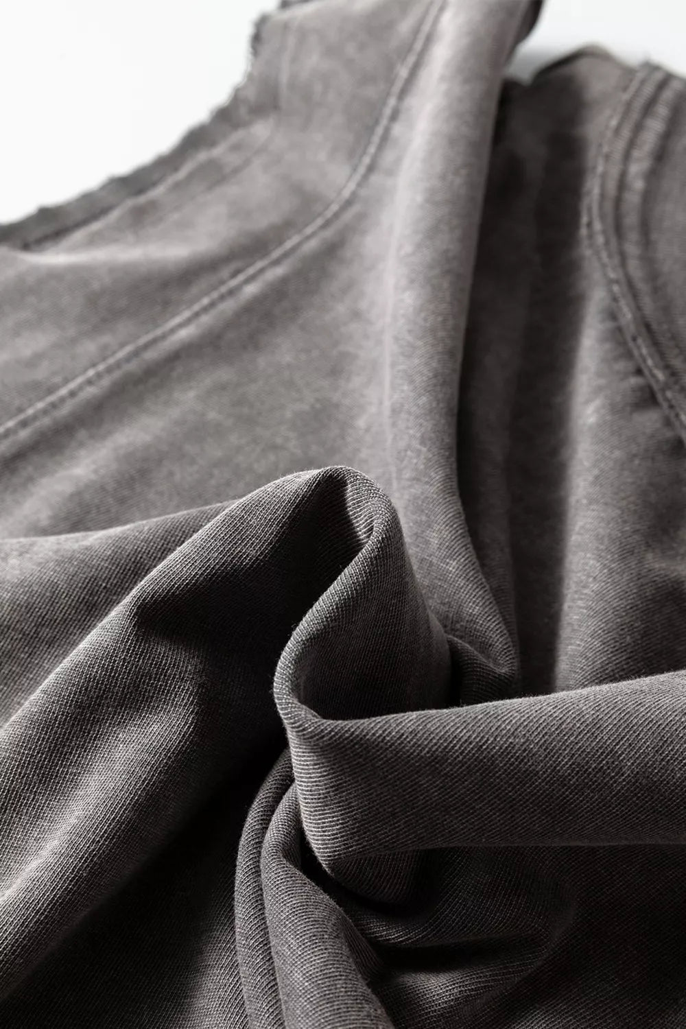 Relaxed mineral wash cotton tank top in grey with distressed neckline detail.