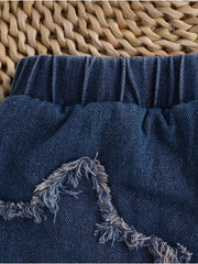 Denim skirt with elastic waist and frayed star applique detail.