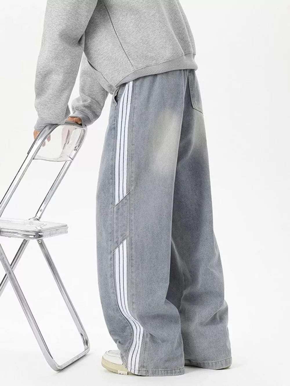 Relaxed fit wide-leg jeans in Vintage Blue with white striped detail and drawstring waist.