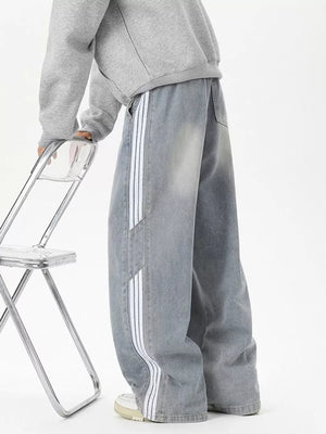 Relaxed fit wide-leg jeans in Vintage Blue with white striped detail and drawstring waist.