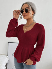 Wine peplum knit sweater with scallop neckline and balloon sleeves.