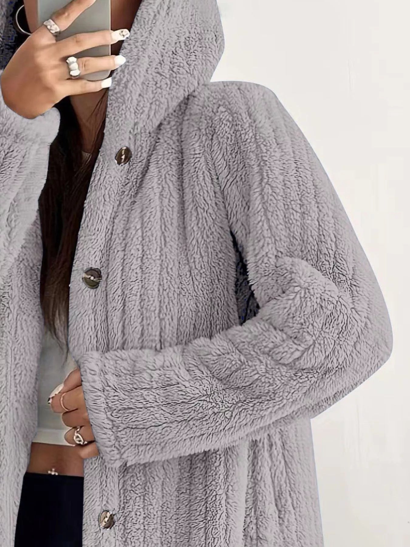 Cozy button-up fleece jacket in light grey with a hood and button closure.
