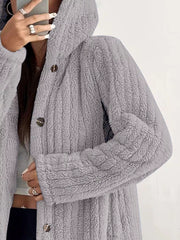 Cozy button-up fleece jacket in light grey with a hood and button closure.