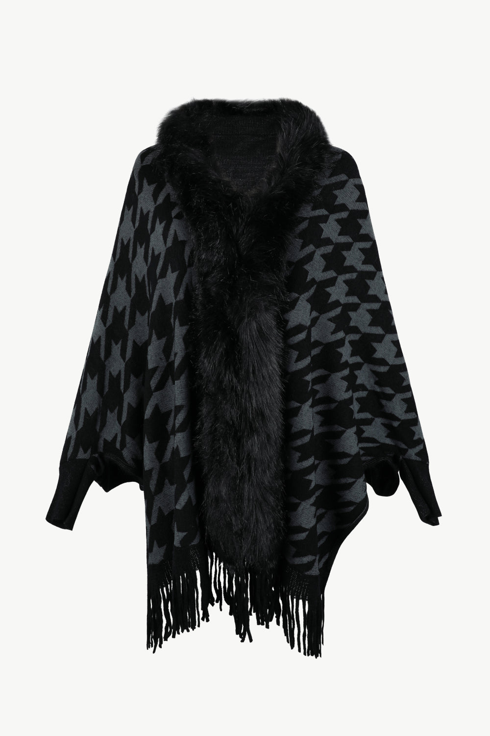 Houndstooth faux fur collar poncho in black and grey with fringe detail.