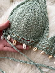 Green crochet halter bikini top with shell trim and tie straps.