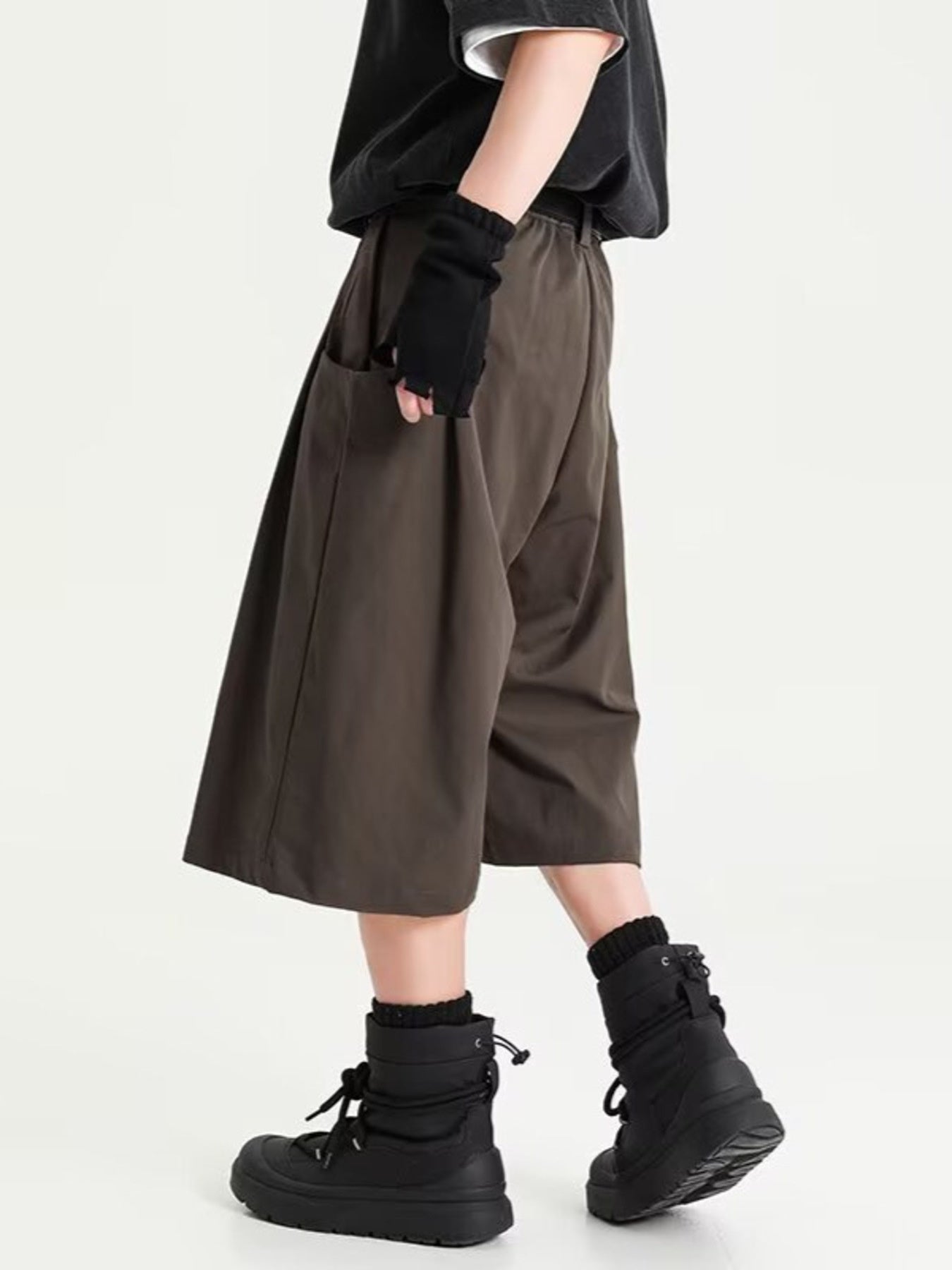 Men's chocolate wide leg shorts with pockets and a relaxed fit.