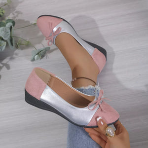 Pink and silver slip-on flats with bow detail