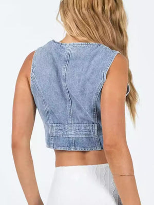 Chic denim vest with V-neck, button-up front, and cropped length.