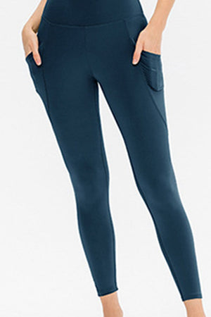 Deep Teal performance leggings with side pockets and a sculpted fit.