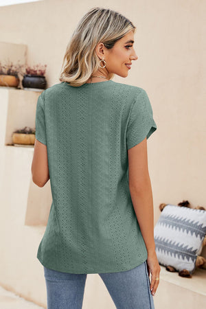 Teal perforated sleeve detail knit top with short sleeves and a V-neck.