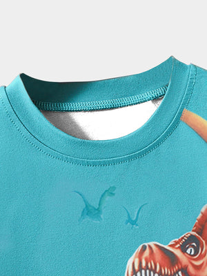 Toddler crewneck t-shirt in blue with a dinosaur adventure graphic and subtle dinosaur print.