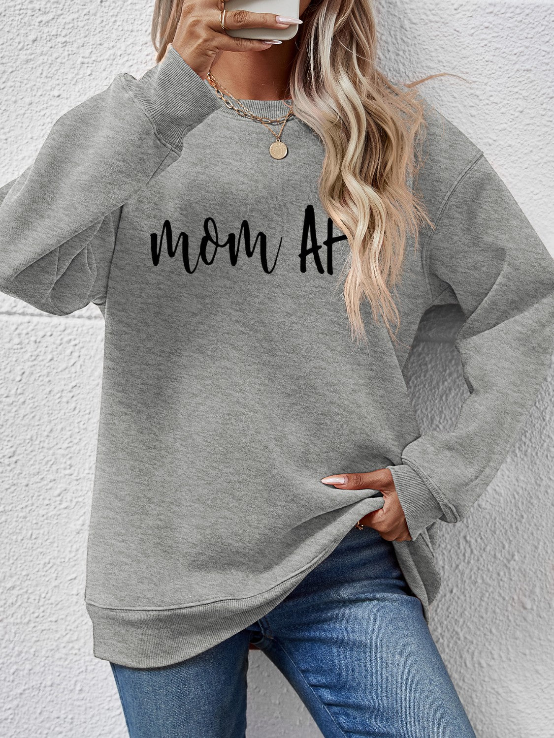 Charcoal graphic sweatshirt with crew neck and long sleeves, featuring "mom AF" text.