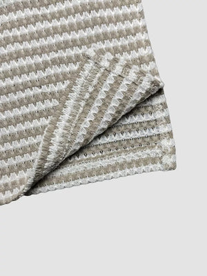 Maternity wide leg trousers in dark brown and white stripe waffle knit fabric.
