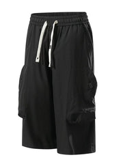 Black cargo capris with adjustable drawstring and large side pockets.