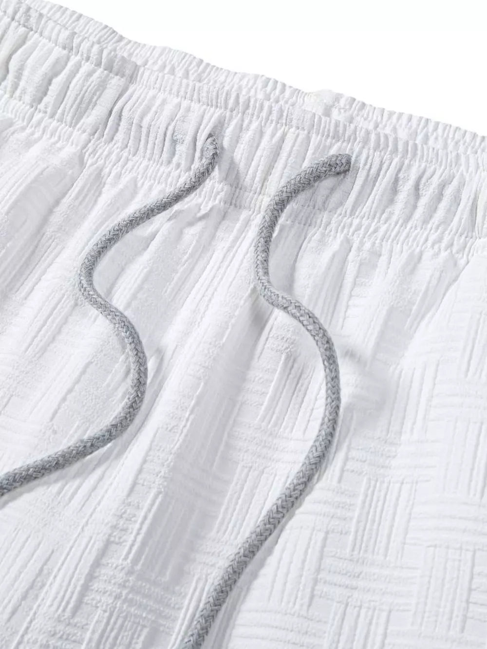 Men's Textured Drawstring Shorts in White, close-up detail