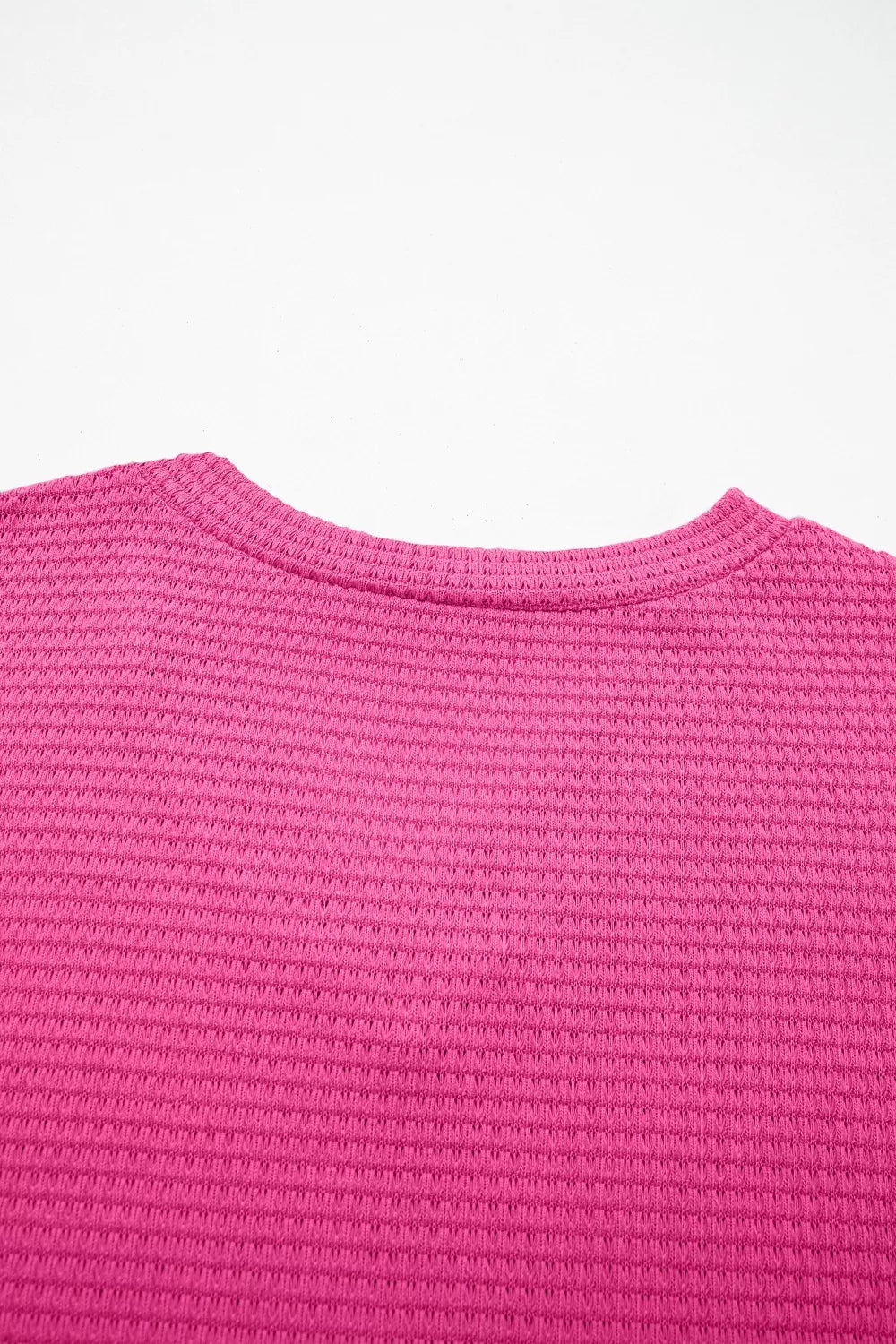 Hot Pink waffle knit V-neck t-shirt with textured polyester fabric.