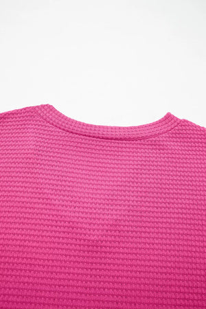 Hot Pink waffle knit V-neck t-shirt with textured polyester fabric.