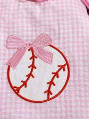 Blush pink gingham baby one-piece with baseball embroidery and a pink bow.
