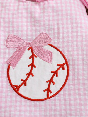 Blush pink gingham baby one-piece with baseball embroidery and a pink bow.