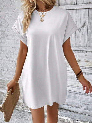White relaxed tee dress with cuffed sleeves and a casual fit